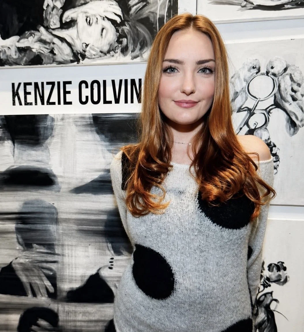 Kenzie Colvin pictured with her black-and-white artwork.