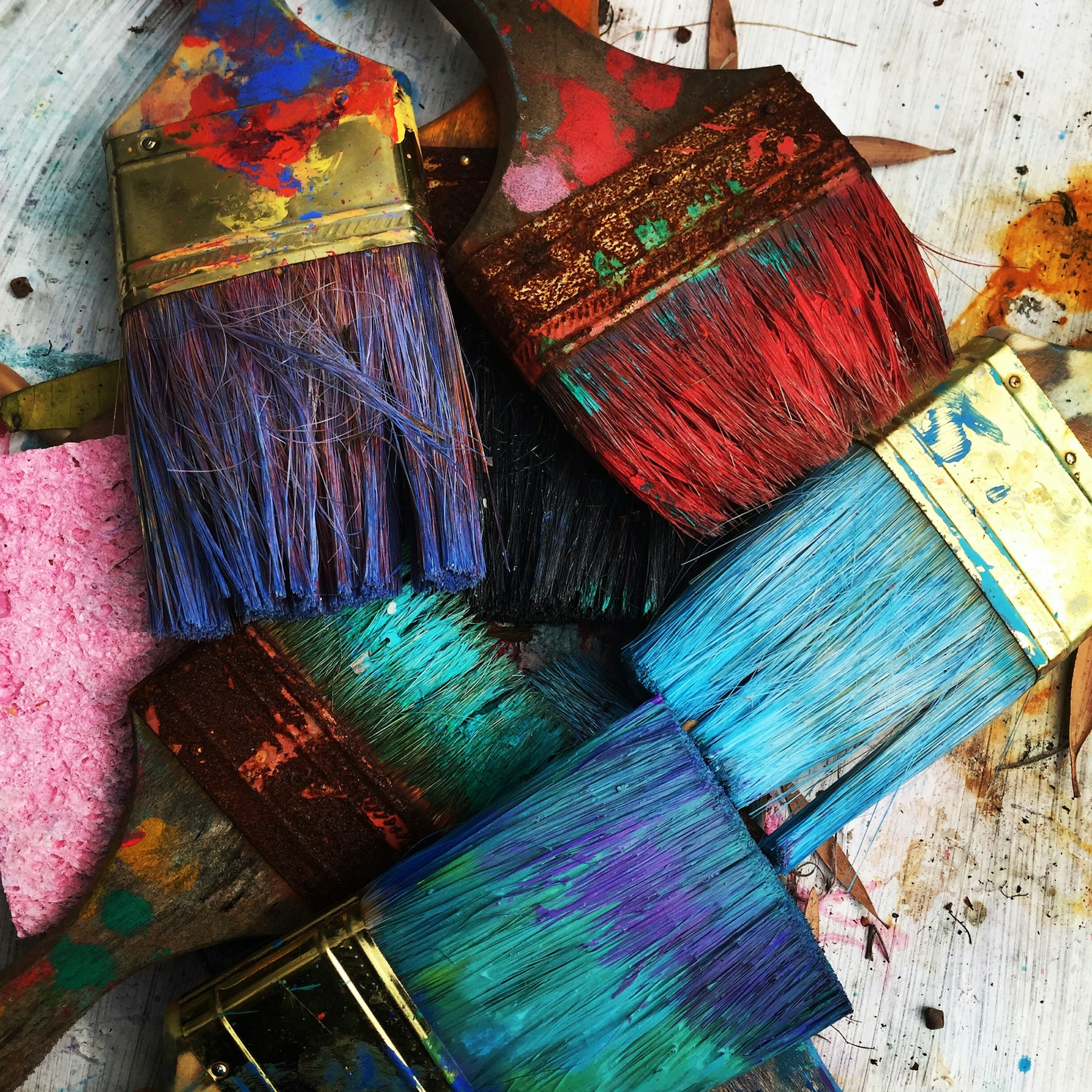 Paint-covered brushes. Illustrative reference photograph, not an applicant's work.